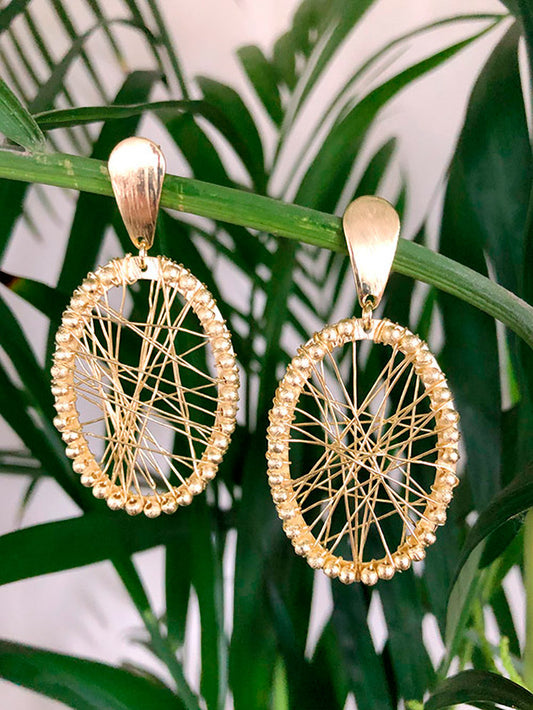 Aretes ovalados telaraña con bolitas alrededor