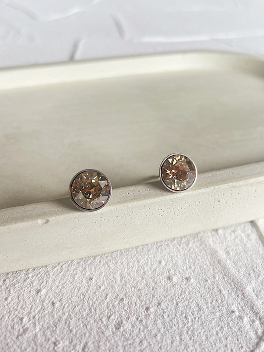 Aretes pegados punto de luz Swarovski