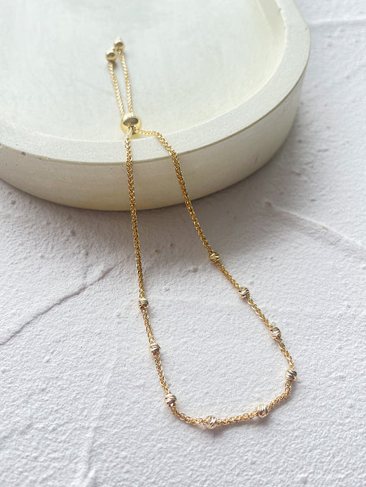 Pulsera regulable bolitas facetadas