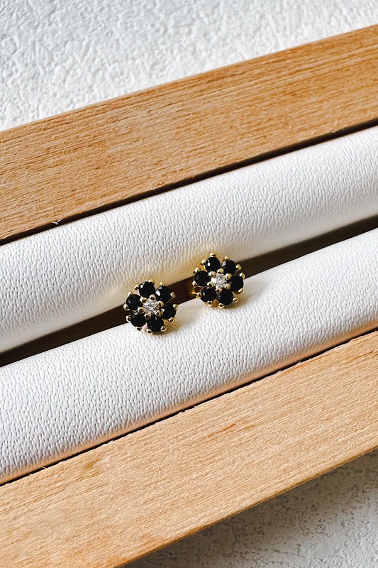 Aretes pegados flor seguro de bebé