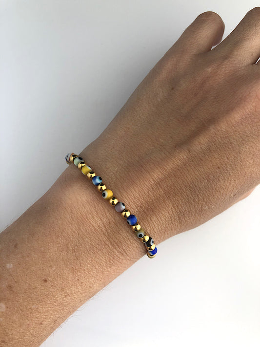 Pulsera elástica ojos turcos con bolas acero chicas