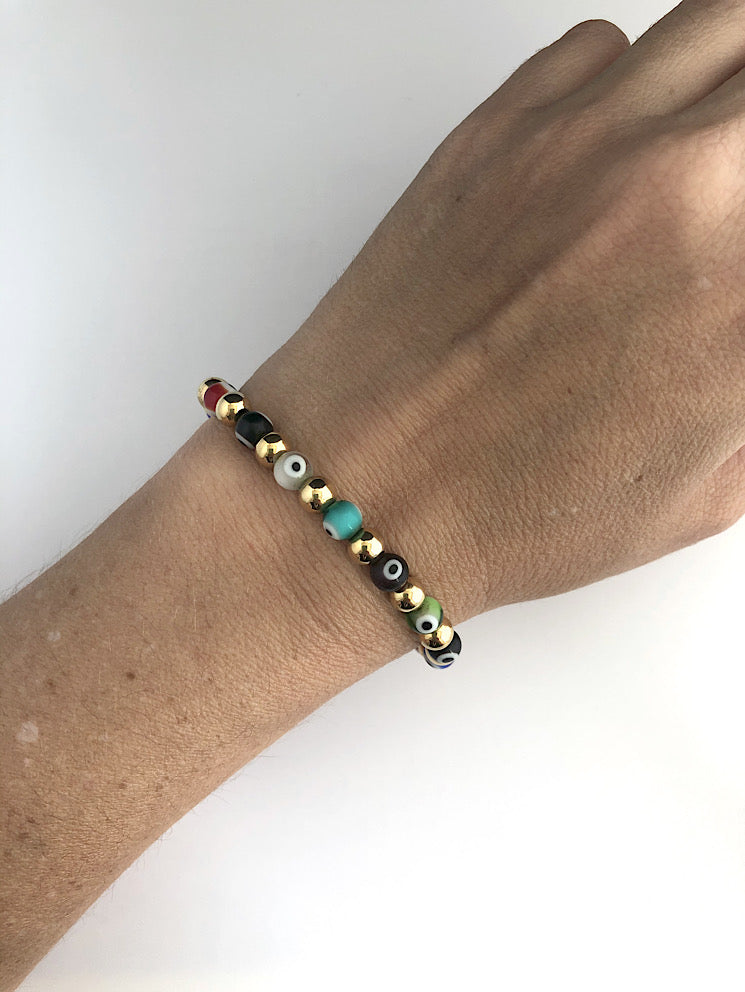 Pulsera elástica ojos turcos con bolas acero chicas