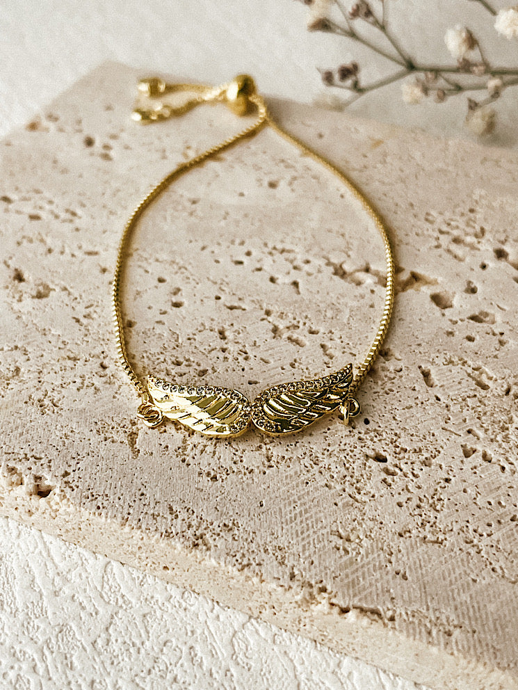 Pulsera regulable + dije alas con circones pasante