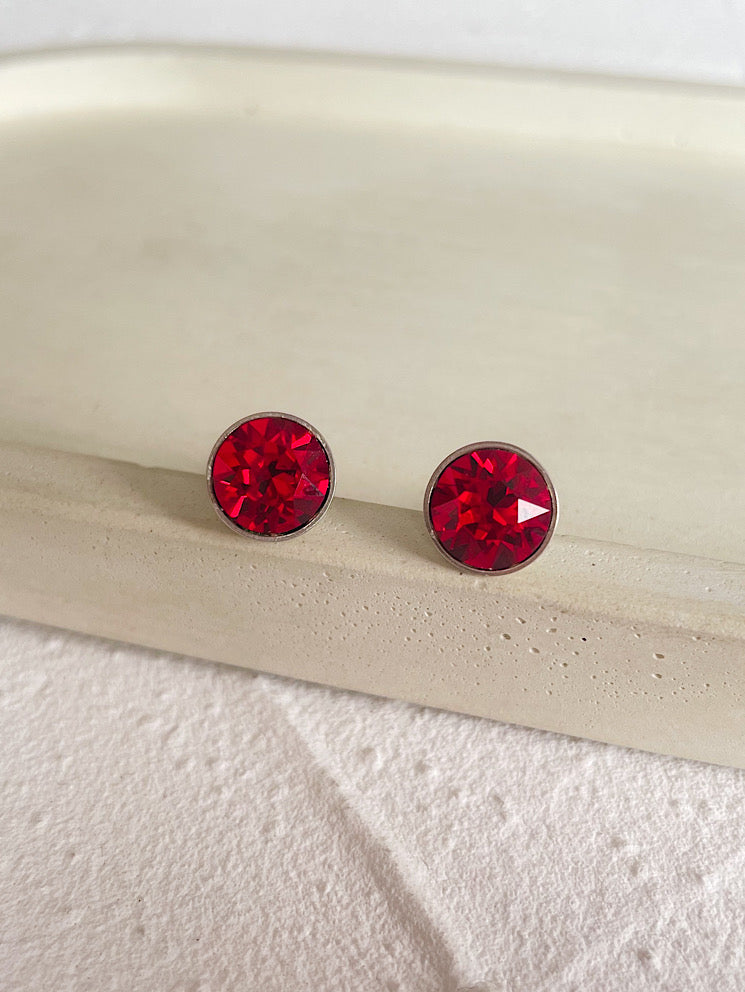 Aretes pegados punto de luz Swarovski