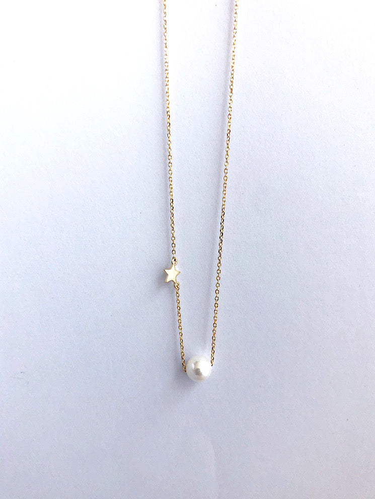 Cadena con perla pasante y estrellita