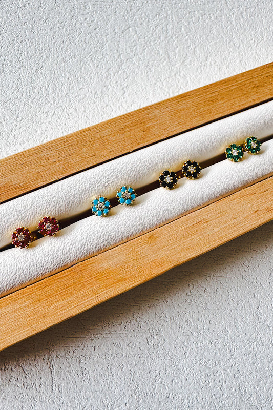 Aretes pegados flor seguro de bebé