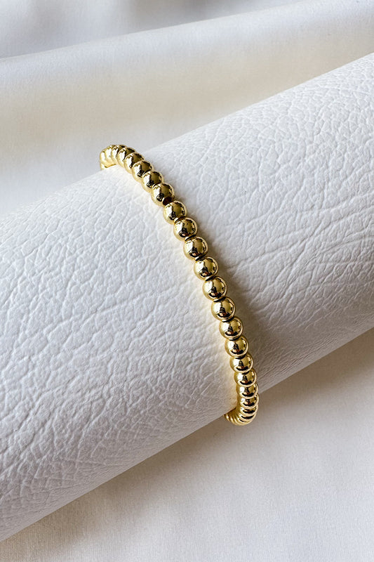 Pulsera elástica con bolitas lisas