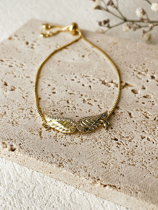Pulsera regulable + dije alas con circones pasante