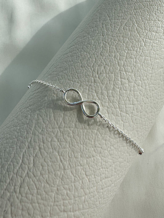 Pulsera cadena con dije infinito y 2 circones