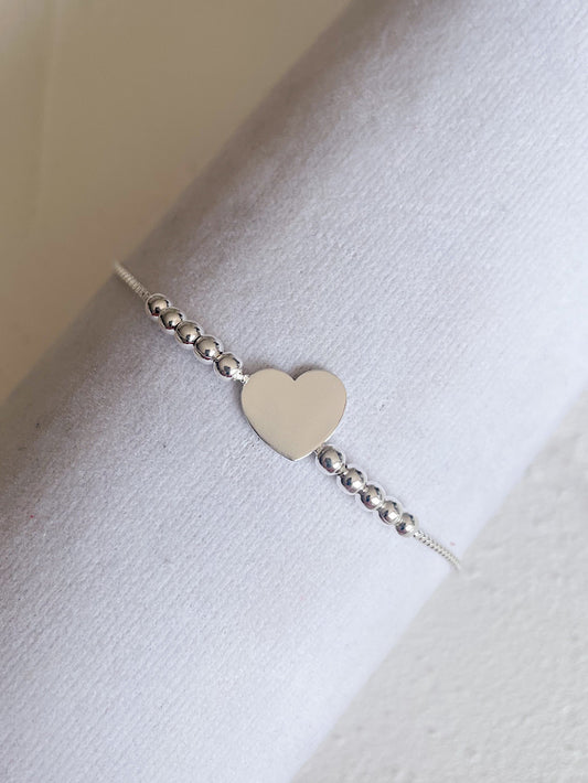 Pulsera regulable corazón liso con bolitas lisas