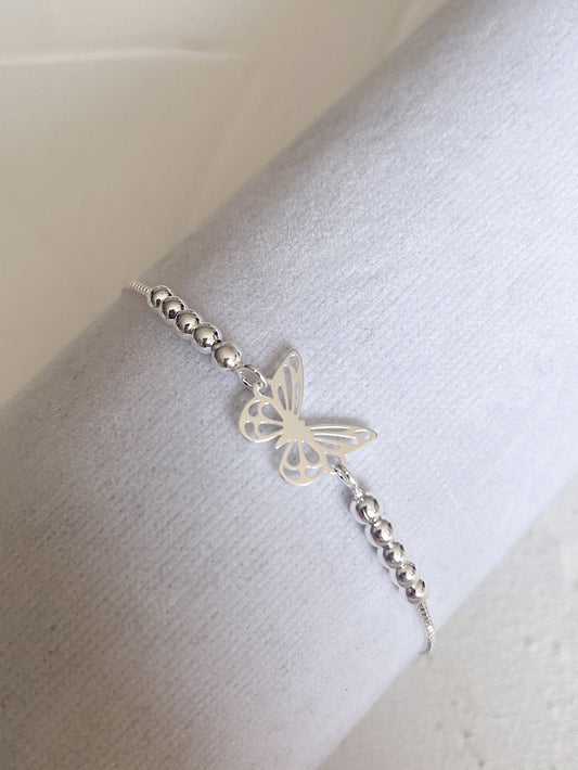 Pulsera regulable mariposa calada con bolitas