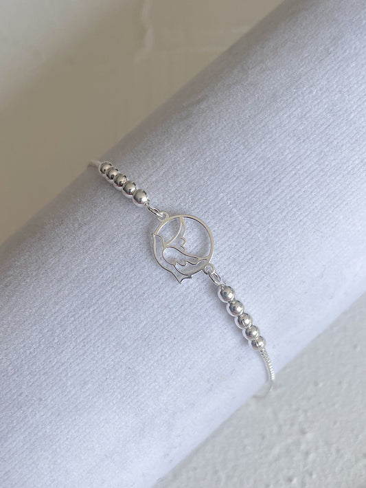 Pulsera regulable paloma calada con bolitas lisas