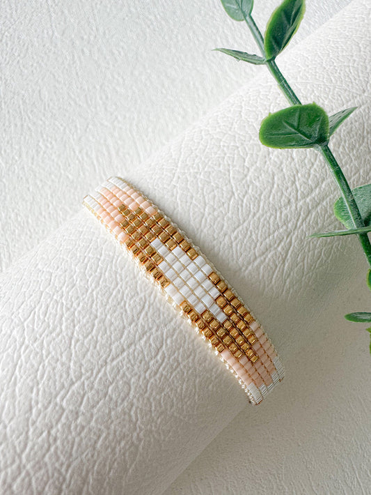 Pulsera tejida 5 filas tonos dorados con rosados