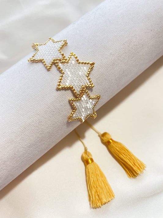 Pulsera tejida miyuki 3 estrellas blancas con dorado